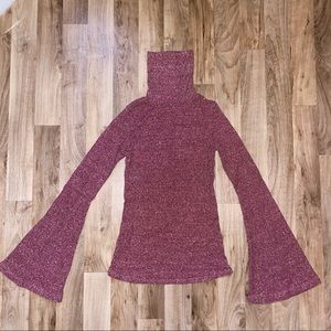 Figure flattering turtleneck with bell sleeves